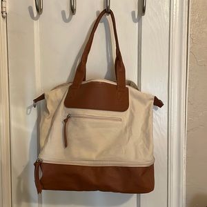 Tote with suitcase handle slip